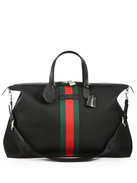 gucci black canvas duffle bag.